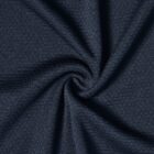 Dark textured fabric swirled, forming a spiral pattern.