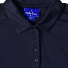 Black collared shirt with a Winning Spirit label.