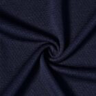 Close-up of dark blue textured fabric, gathered in a spiral pattern.