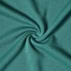 Green textured fabric with a spiral twist pattern in the center.