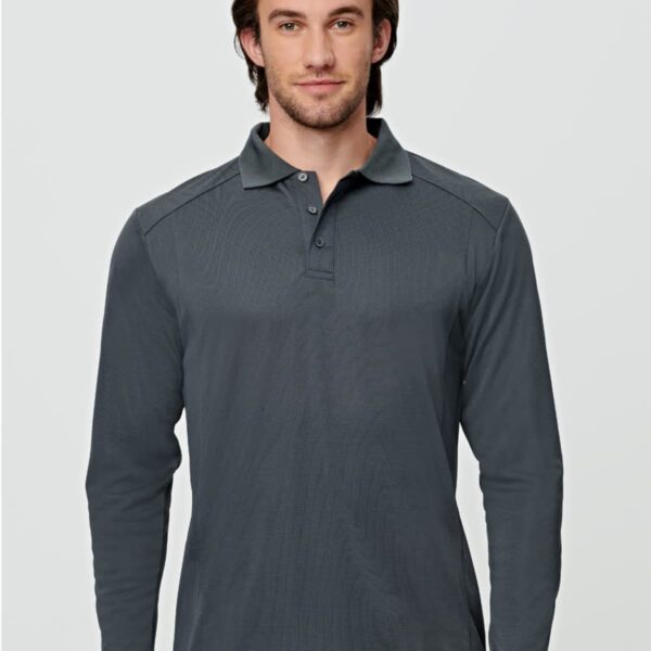 A person wearing a long-sleeve gray polo shirt stands against a plain background.