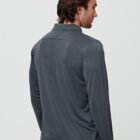 Man wearing a long-sleeve grey shirt, viewed from behind against a gray background.