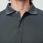 Man wearing a dark gray polo shirt, only lower face and upper chest visible.