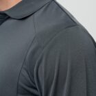 Close-up of a person wearing a dark gray collared shirt.