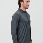 Man in a dark gray, long-sleeve polo shirt standing sideways against a light gray background.