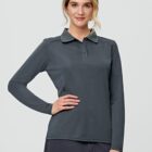 Person wearing a dark long-sleeve polo shirt, posing with a hand on hip.