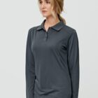 Person wearing a dark long-sleeve polo shirt, looking to the side.
