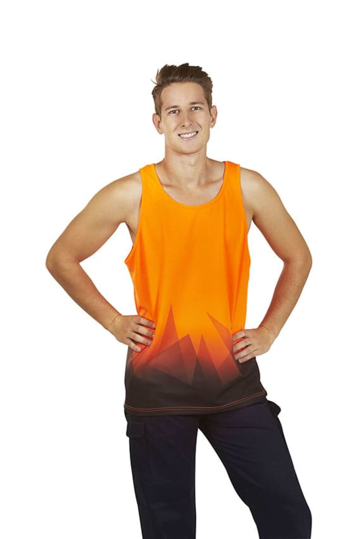 Smiling person in an orange tank top with a black geometric pattern, posing with hands on hips.
