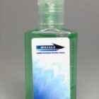 Clear bottle of green hand sanitizer labeled WASSEA with blue and white graphics.