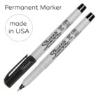Two black Sharpie permanent markers, one capped and one uncapped, with made in USA text.
