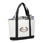 White tote bag with black straps, filled with newspapers and magazines.