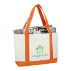 Canvas tote bag with orange handles, filled with newspapers and a magazine.