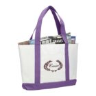 White and purple tote bag with magazines inside.