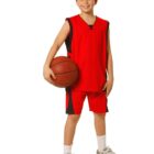Child in red basketball uniform holding a ball, smiling against a white background.