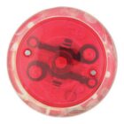 A red translucent yo-yo viewed from above, showing its inner mechanisms.