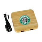Square wooden device with Starbucks logo, USB cable beside it, on a white background.