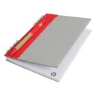 Open spiral notebook with lined pages and a red pen attached.