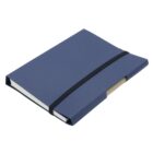 A closed blue notebook with a black elastic band wrapped around it. The notebook is positioned at an angle, showing its spine and part of the pages inside.