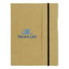 Beige notebook with Pacific Life logo, a blue whale, and a black elastic band closure.