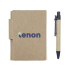 A small brown notebook with rounded edges, accompanied by a matching brown pen. The notebook cover features the text tenon in blue lowercase lettering with a small green cross symbol above the t.