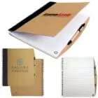 Three spiral notebooks, two closed, one open, displaying lined pages with pens attached.
