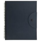 A closed, dark blue spiral-bound notebook with a textured cover and a rounded flap with a button closure on the right side. The notebook is positioned vertically, showing its front cover.