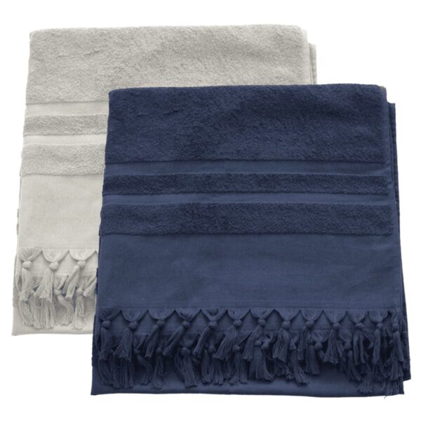 Two folded towels are stacked. The top towel is dark blue, featuring textured stripes and fringed tassels. The towel beneath is light gray with a similar design. Both are neatly arranged.