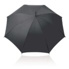 Black umbrella fully opened on a white background.