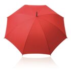 A red umbrella fully opened against a white background.