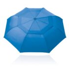 A fully opened blue umbrella viewed from above on a white background.