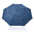 Blue umbrella fully opened, viewed from above, on a white background with a reflection below.
