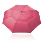 A red umbrella fully opened, viewed from above on a white background.