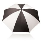 A large, open canopy umbrella with alternating black and white panels on a white background.