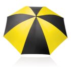 A yellow and black alternating panel umbrella open against a white background. The umbrellas pattern resembles a spiral, and it casts a subtle reflection below.