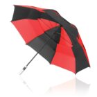A red and black umbrella with a silver handle against a white background.
