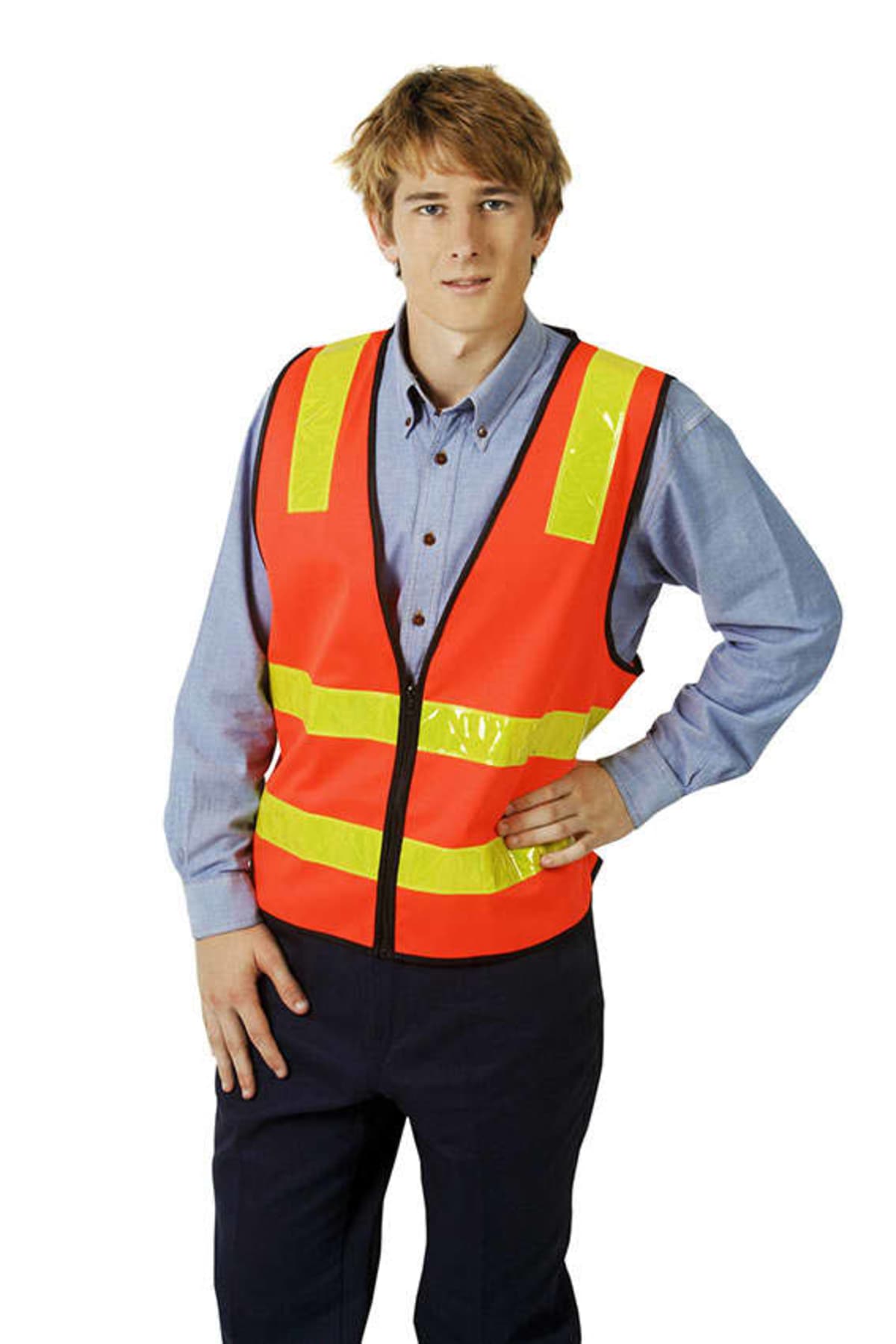 Person in a reflective orange safety vest and blue shirt standing with one hand on hip.