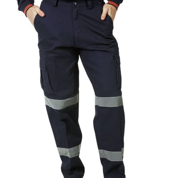 Person wearing navy cargo pants with reflective stripes, orange top, and tan work boots.