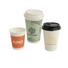 Three branded paper cups with distinct designs and logos on a white background.