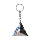 Triangular keychain with geometric and abstract patterns in various colors.