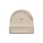 A plain beige knit beanie hat with a folded brim, displayed on a white background.
