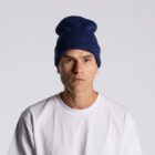 Person wearing a blue beanie and white shirt, facing forward against a plain background.