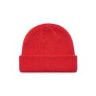 A plain red knit beanie hat with a folded brim on a white background.