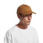 Man in a brown baseball cap and white t-shirt facing slightly to the right.