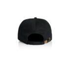 Back view of a black baseball cap with an adjustable strap and brass buckle.