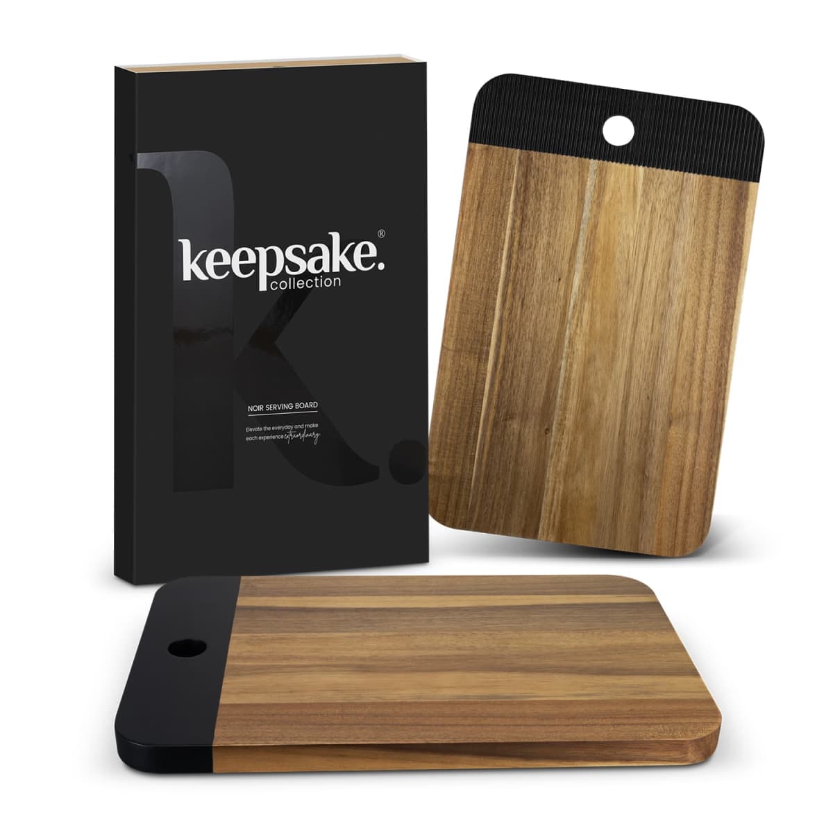 Wooden serving board with a black accent and packaging labeled keepsake collection.
