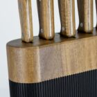 Wooden knife block with inserted knives against a plain background.