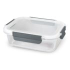 Rectangular glass food container with a white lid and gray clasps.