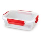 Clear food container with red clasps and a white lid.