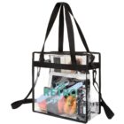 Clear tote bag with black straps, containing various items and The Retro Studio logo on front.