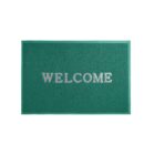 Green doormat with WELCOME written in white letters.
